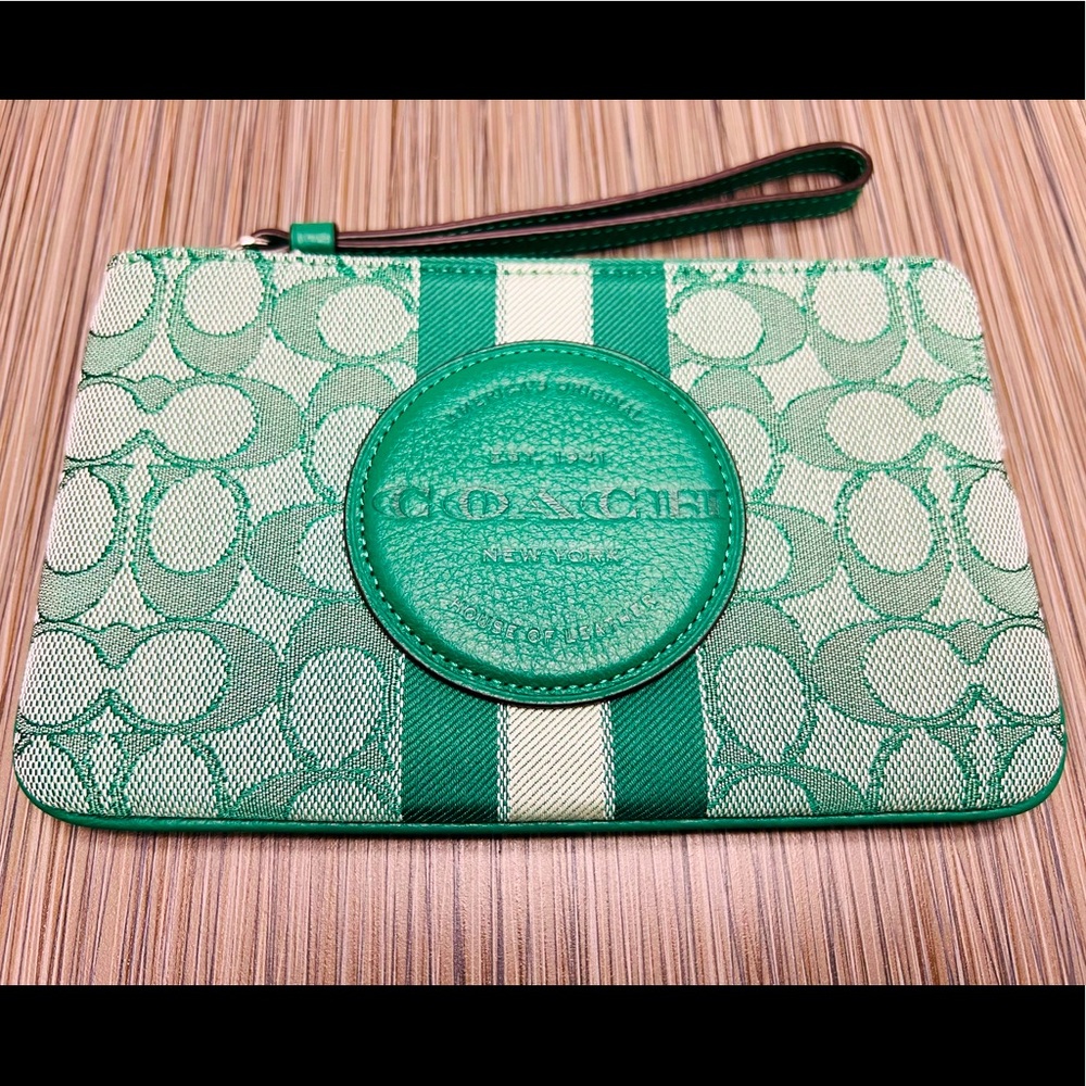 Coach green Dempsey monogram Jacquard clutch bag